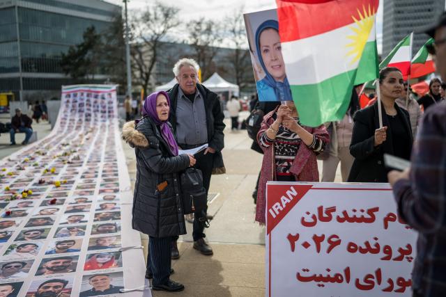 Protesters take part in a demonstration in front of the United Nations Offices on the sideline of the 61st session of the UN Human Rights Council in Geneva on February 23, 2026. (Photo by Fabrice COFFRINI / AFP)