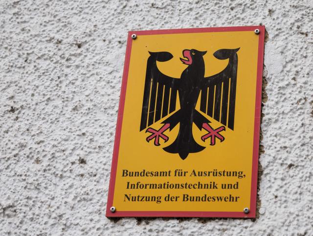 A picture shows a sign on the headquarters' building of the Federal Office of Bundeswehr Equipment, Information Technology and In-Service Support (Bundesamt für Ausruestung, Informationstechnik und Nutzung der Bundeswehr - BAAINBw) of the German Army Bundeswehr on February 23, 2026 in Koblenz, Rhineland-Palatinate, western Germany. (Photo by HANNES P ALBERT / AFP)