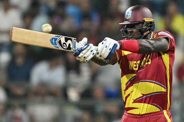 West Indies' Jason Holder plays a shot during the 2026 ICC Men's T20 Cricket World Cup Super Eights match between West Indies and Zimbabwe at the Wankhede Stadium in Mumbai on February 23, 2026. (Photo by Indranil MUKHERJEE / AFP)