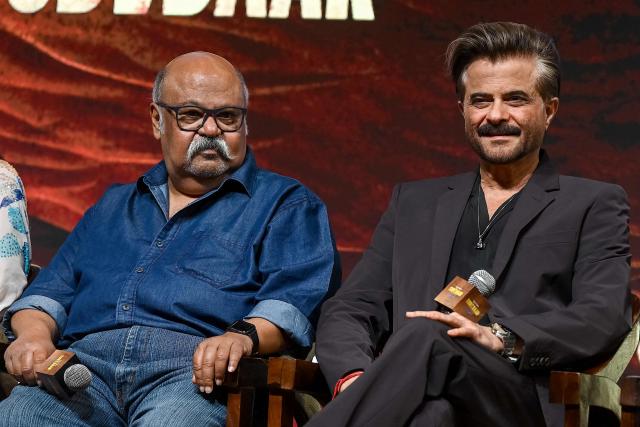 Bollywood actors Saurabh Shukla (L) and Anil Kapoor attend the trailer launch of their upcoming Indian Hindi-language action-drama film 'Subedaar' in Mumbai on February 23, 2026. (Photo by Sujit JAISWAL / AFP)