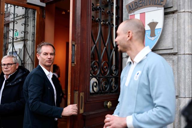 Former Olympic skiing champion and President of the Coordination Commission for the 2030 Winter Olympics Edgar Grospiron takes part in a ceremony of arrival of the Olympic flag marking the handover from Milano Cortina 2026 to French Alps 2030 Winter Olympic Games, in the French Alps in Albertville, south-eastern France on February 23, 2026. (Photo by Alex MARTIN / AFP)