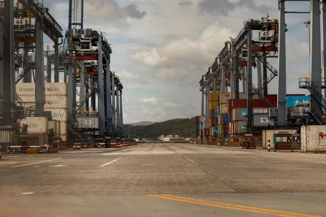 This view shows the Port of Balboa, managed by CK Hutchison Holdings based in Hong Kong, at the entrance to the Panama Canal in Panama City on February 23, 2026. Panamanian maritime authorities on February 23, 2026, took control of two ports on the Panama Canal from Hong Kong-based CK Hutchison after its concession was annulled following pressure from the United States. (Photo by MARTIN BERNETTI / AFP)
