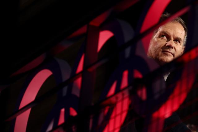 Former Olympic skiing champion and President of the Coordination Commission for the 2030 Winter Olympics Edgar Grospiron looks on during a live broadcast of French TV channel France Televisions ahead of the official celebration of the return of the athletes of the French delegation from the Milano Cortina 2026 Winter Olympic Games in Albertville, south-eastern France on February 23, 2026, as the Olympic flag arrives in the French Alps for the 2030 Olympic Games. (Photo by Alex MARTIN / AFP)