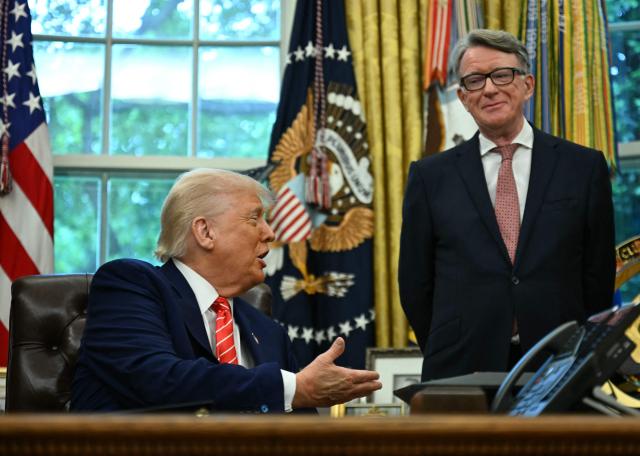 (FILES) US President Donald Trump shakes hands with British ambassador to the United States Peter Mandelson  after making a trade announcement in the Oval Office of the White House in Washington, DC, on May 8, 2025. Police on February 23, 2026 arrested former British ambassador to the United States Peter Mandelson in a misconduct in public office probe, amid allegations over his ties to disgraced US financier Jeffrey Epstein. "Officers have arrested a 72-year-old man on suspicion of misconduct in public office," the Metropolitan police said in a statement, following previous searches of Mandelson's home and as broadcast footage appeared to show Mandelson being driven away from his home. (Photo by Jim WATSON / AFP)