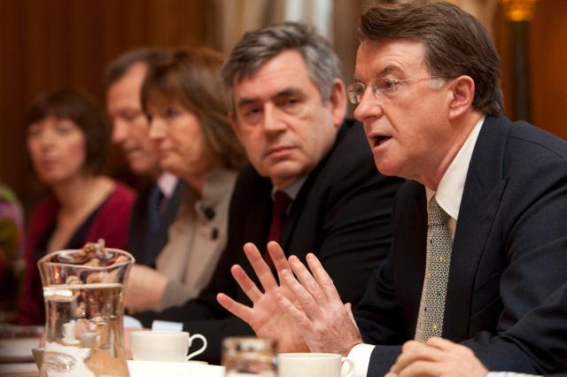 (FILES) British Business Secretary Peter Mandelson (R) talks during a breakfast and roundtable discussion hosted by British Prime Minister Gordon Brown (2nd R) for leading women in business to mark International Women's Day, at 10 Downing Street, in central London, on March 8, 2010. Police on February 23, 2026 arrested former British ambassador to the United States Peter Mandelson in a misconduct in public office probe, amid allegations over his ties to disgraced US financier Jeffrey Epstein. "Officers have arrested a 72-year-old man on suspicion of misconduct in public office," the Metropolitan police said in a statement, following previous searches of Mandelson's home and as broadcast footage appeared to show Mandelson being driven away from his home. (Photo by Carl COURT / POOL / AFP)