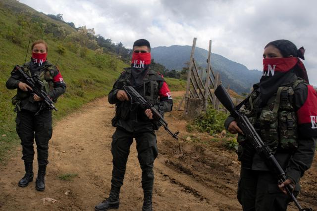 (FILES) National Liberation Army ELN rebels of the Manuel Vazquez Castano northeastern war front stand guard at Catatumbo region, Colombia on March 8, 2025. Colombia's largest guerrilla group on February 23, 2026 announced a unilateral ceasefire during upcoming elections, amid a surge in political violence including attacks, kidnappings and threats against candidates and leaders. (Photo by AFP)
