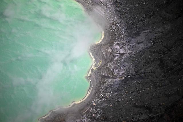 This aerial view shows the crater of the Ilamatepec Volcano in Santa Ana, El Salvador, on February 21, 2026. In El Salvador, there are 242 volcanoes, 36 of which are considered active, according to data from the Ministry of Environment and Natural Resources of El Salvador. (Photo by Marvin RECINOS / AFP)