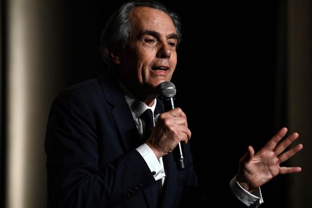 Candidate for the upcoming municipal election in Bordeaux Philippe Dessertine speaks during an electoral meeting at a theatre in Bordeaux, south-western France, on February 23, 2026. (Photo by Christophe ARCHAMBAULT / AFP)