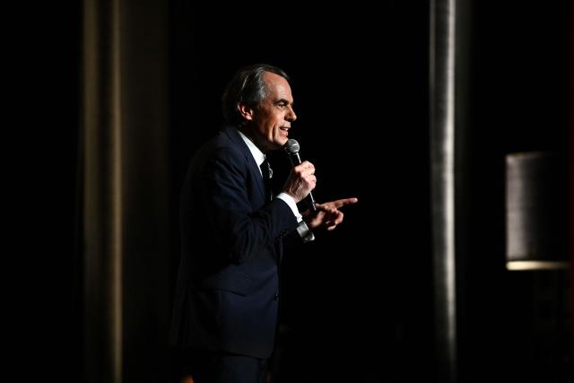 Candidate for the upcoming municipal election in Bordeaux Philippe Dessertine speaks during an electoral meeting at a theatre in Bordeaux, south-western France, on February 23, 2026. (Photo by Christophe ARCHAMBAULT / AFP)