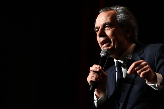 Candidate for the upcoming municipal election in Bordeaux Philippe Dessertine speaks during an electoral meeting at a theatre in Bordeaux, south-western France, on February 23, 2026. (Photo by Christophe ARCHAMBAULT / AFP)