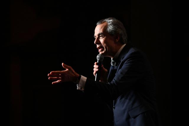 Candidate for the upcoming municipal election in Bordeaux Philippe Dessertine speaks during an electoral meeting at a theatre in Bordeaux, south-western France, on February 23, 2026. (Photo by Christophe ARCHAMBAULT / AFP)