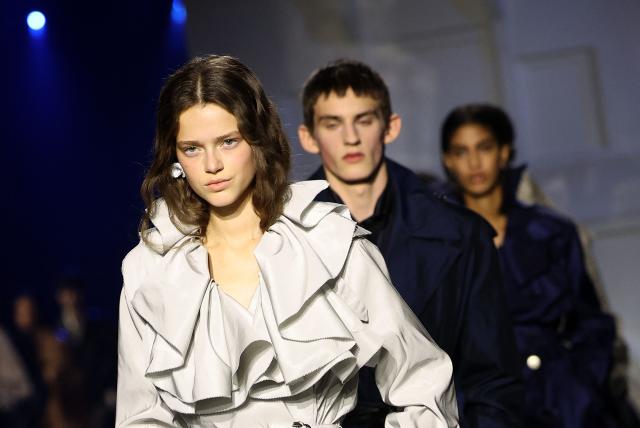 Models present creations during a catwalk presentation for Burberry's Autumn/Winter 2026 collection, during London Fashion Week in London on February 23, 2026. (Photo by Toby Shepheard / AFP)