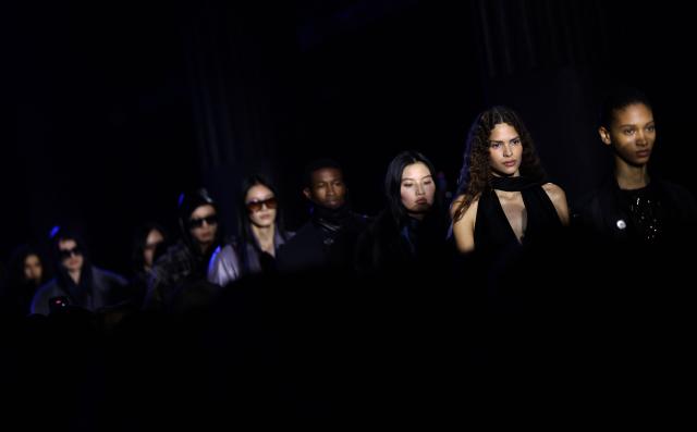 Models present creations during a catwalk presentation for Burberry's Autumn/Winter 2026 collection, during London Fashion Week in London on February 23, 2026. (Photo by Toby Shepheard / AFP)