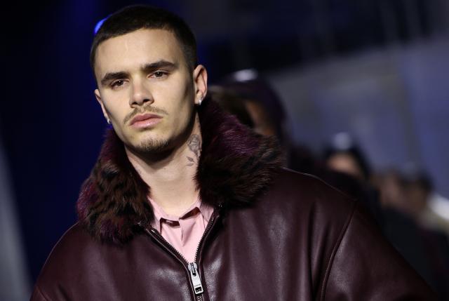 Model Romeo Beckham presents a creation during a catwalk presentation for Burberry's Autumn/Winter 2026 collection, during London Fashion Week in London on February 23, 2026. (Photo by Toby Shepheard / AFP)