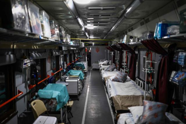 This photograph shows an internal view of a newly designed Ukrainian railway Intensive Care (ICU) carriage, on display at the Kyiv central train station on February 23, 2026, ahead of the fourth anniversary of Russia's invasion of Ukraine. Russia launched its full-scale invasion of Ukraine on February 24, 2022, unleashing the deadliest war in Europe since World War II. (Photo by HENRY NICHOLLS / AFP)