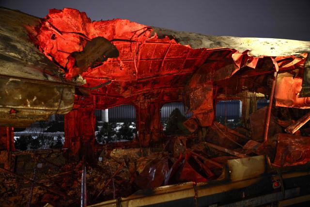 This photograph shows a Ukrainian railway carriage that was attacked by a Russian drone on January 27, 2026 near Kharkiv in eastern Ukraine killing six people, on display at the Kyiv central train station on February 23, 2026, ahead of the fourth anniversary of Russia's invasion of Ukraine. Russia launched its full-scale invasion of Ukraine on February 24, 2022, unleashing the deadliest war in Europe since World War II. (Photo by HENRY NICHOLLS / AFP)