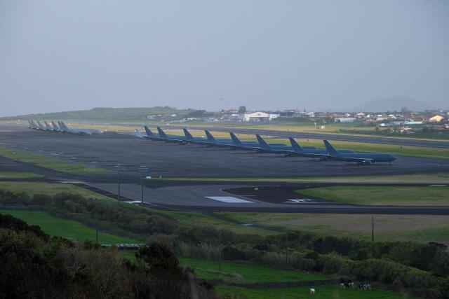 A row of some fifteen US Airforce KC-46 Pegasus tankers and one P-8 Poseidon tankers from the US Navy are seen stationed at Lajes Air Base, Praia da Vitória, Terceira island, in the Azores archipielago in the Atlantic Ocean on February 23, 2026. Amid tensions with Iran, the United States has intensified its use of the Lajes air base in the Azores. The two countries are scheduled to resume their diplomatic talks on Thursday. (Photo by ANTONIO ARAUJO / AFP)