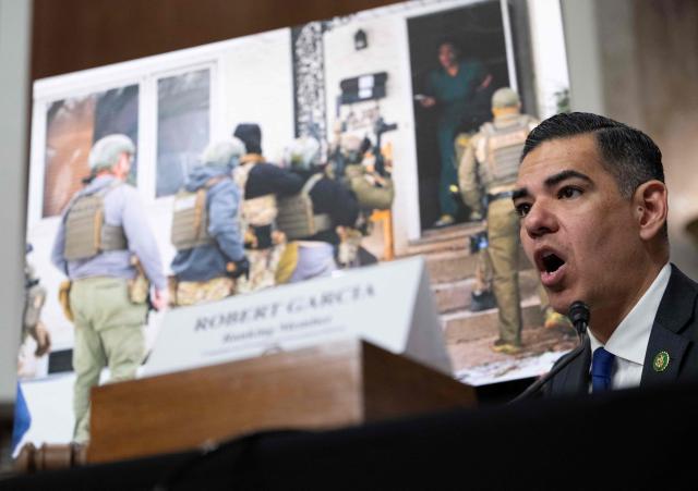 US House Oversight and Government Reform Committee ranking member Representative Robert Garcia, Democrat of California, speaks in front of a picture of Teyana Gibson Brown, a resident of Minneapolis, Minnesota, confronting federal agents as they raid her home during a forum on Immigration and Customs Enforcement (ICE) at the Dirksen Senate Office Building at the US Capitol on February 23, 2026 in Washington, DC. (Photo by ANDREW CABALLERO-REYNOLDS / AFP)