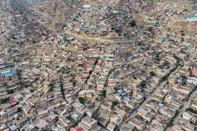 This aerial view shows the Valle Alto human settlement of the Villa Maria del Triunfo district in Lima on February 23, 2026. Peru will hold a presidential election on April 12, 2026. (Photo by Connie FRANCE / AFP)