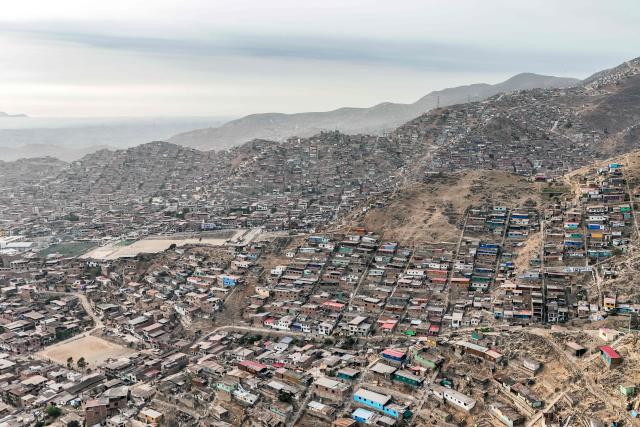 This aerial view shows the Valle Alto human settlement of the Villa Maria del Triunfo district in Lima on February 23, 2026. Peru will hold a presidential election on April 12, 2026. (Photo by Connie FRANCE / AFP)