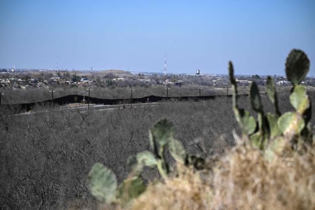 The US-Mexico border wall is pictured in the outskirts of Eagle Pass, Texas, on February 19, 2026. (Photo by RONALDO SCHEMIDT / AFP)