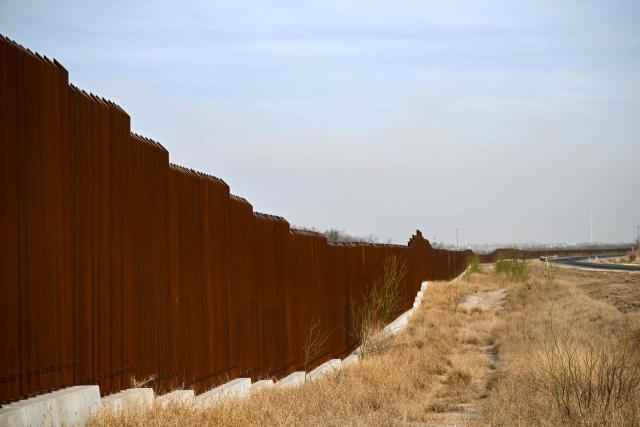 The US-Mexico border wall is seen on the outskirts of Eagle Pass, Texas, on February 19, 2026. (Photo by RONALDO SCHEMIDT / AFP)