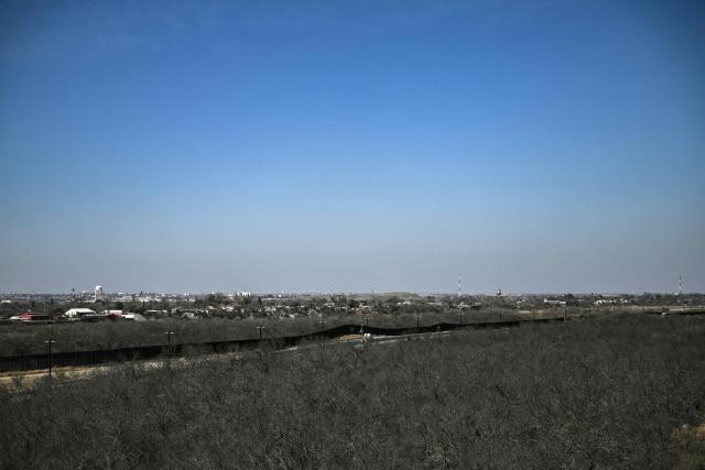 The US-Mexico border wall is pictured in the outskirts of Eagle Pass, Texas, on February 19, 2026. (Photo by RONALDO SCHEMIDT / AFP)