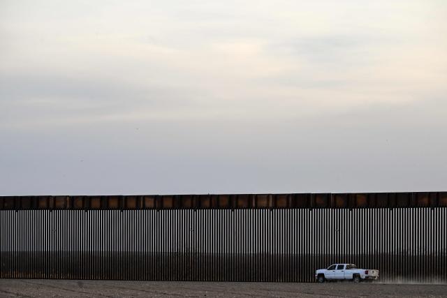 A truck rides along the US-Mexico border wall in Quemado, Texas, on February 18, 2026. (Photo by RONALDO SCHEMIDT / AFP)