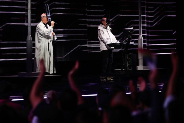 British singer Neil Tennant (L) and keyboardist Chris Lowe (R), of synth-pop duo Pet Shop Boys, perform on stage during the 65th Vina del Mar International Song Festival in Vina del Mar, Chile on February 23, 2025. (Photo by Javier TORRES / AFP)
