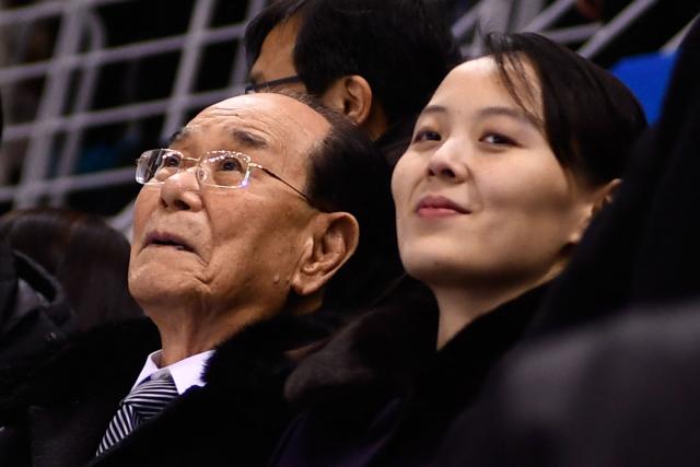 (FILES) North Korean leader Kim Jong Un's sister Kim Yo Jong (R) and North Korea's ceremonial head of state Kim Yong Nam attend the women's preliminary round ice hockey match between Switzerland and the Unified Korean team during the Pyeongchang 2018 Winter Olympic Games at the Kwandong Hockey Centre in Gangneung on February 10, 2018. The Workers' Party Central Committee on February 23, 2026, named Kim Yo Jong -- previously a deputy department director -- as a full department director, Pyongyang's official Korean Central News Agency (KCNA) said. (Photo by Brendan Smialowski / AFP)