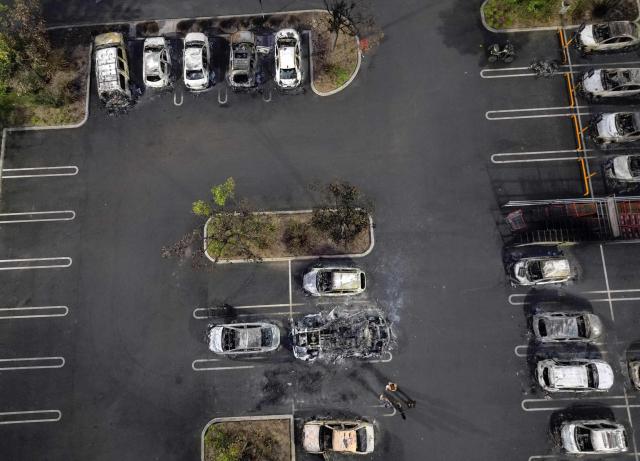 Aerial view of burned cars in the parking lot of a Costco retail store in Puerto Vallarta, Jalisco state, Mexico, on February 23, 2026. Mexico has deployed 10,000 troops to quell clashes sparked by the killing of the country's most wanted drug lord, which have left dozens dead, officials said on February 23. Nemesio "El Mencho" Oseguera, leader of the Jalisco New Generation Cartel (CJNG), was wounded on February 22 in a shootout with soldiers in the town of Tapalpa in Jalisco state and died while being flown to Mexico City, the army said. (Photo by Alfredo ESTRELLA / AFP)