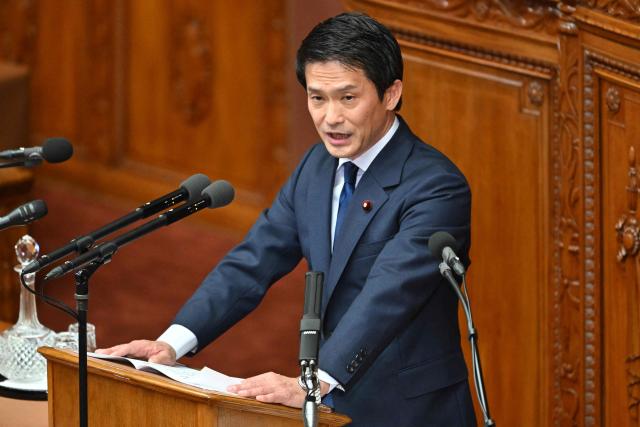 Japan's main opposition party Centrist Reform Alliance leader Junya Ogawa asks questions to Prime Minister Sanae Takaichi during a plenary session of the House of Representatives in Tokyo on February 24, 2026. (Photo by Kazuhiro NOGI / AFP)