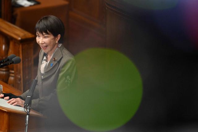 Japan's Prime Minister Sanae Takaichi answers questions from Junya Ogawa, leader of the Centrist Reform Alliance, during a plenary session of the House of Representatives in Tokyo on February 24, 2026. (Photo by Kazuhiro NOGI / AFP)