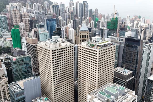 This photo shows an aerial view of the Central business district in Hong Kong on February 24, 2026, a day before the Hong Kong Budget is announced. (Photo by Peter PARKS / AFP)