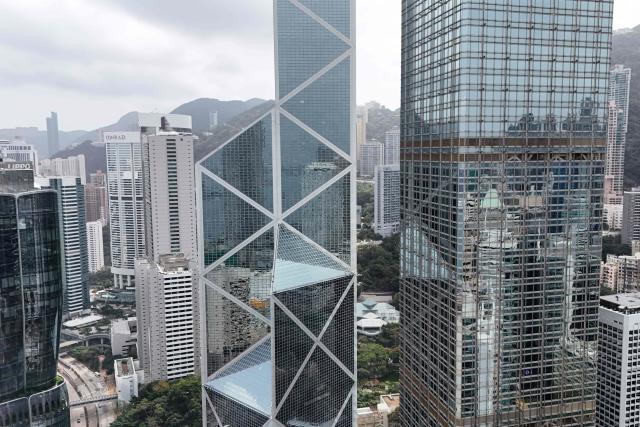 This photo shows an aerial view of the Central business district in Hong Kong on February 24, 2026, a day before the Hong Kong Budget is announced. (Photo by Peter PARKS / AFP)
