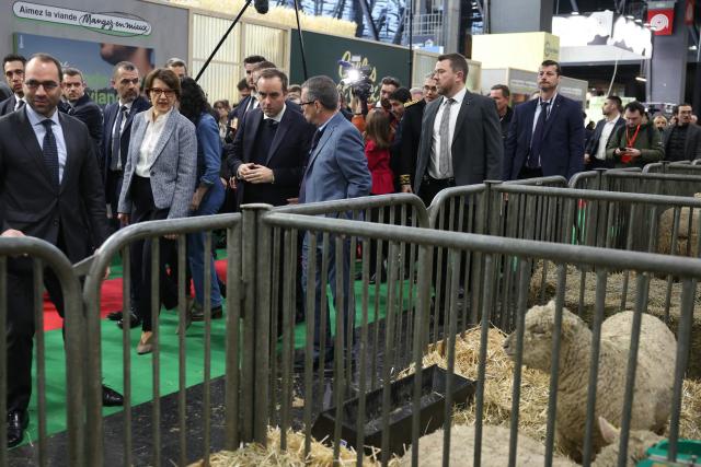 France's Prime Minister Sebastien Lecornu (C-L) and France's Agriculture Minister Annie Genevard (2nd L) visit the Paris International Agricultural Show (Salon de l'Agriculture) at Paris Expo Porte de Versailles in Paris on February 24, 2026. (Photo by Alain JOCARD / AFP)