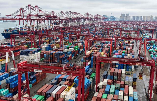 Gargo containers are seen at a port in Qingdao, eastern China's Shandong province on February 24, 2026. (Photo by CN-STR / AFP) / China OUT