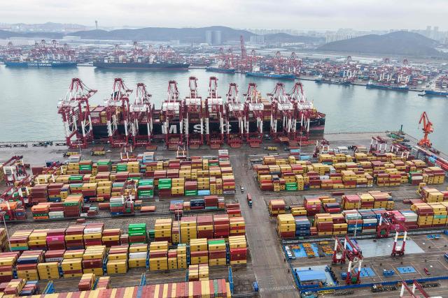 Gargo containers are seen at a port in Qingdao, eastern China's Shandong province on February 24, 2026. (Photo by CN-STR / AFP) / China OUT