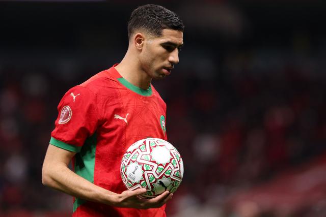 (FILES) Morocco's defender #02 Achraf Hakimi holds the ball during the Africa Cup of Nations (CAN) semi-final football match between Nigeria and Morocco at the Prince Moulay Abdellah stadium in Rabat on January 14, 2026. Moroccan international and PSG football player Achraf Hakimi is being sent back to trial for the rape of a young woman in February 2023, AFP learned on February 24, 2026 from the player's lawyer and the Nanterre public prosecutor's office. (Photo by FRANCK FIFE / AFP)