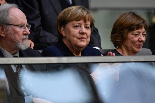 (L-R) Former German Bundestag President Wolfgang Thierse, former German chancellor Angela Merkel and partner of former German President Joachim Gauck Daniela Schadt attend a commemoration ceremony for late former Bundestag President Rita Suessmuth at the Bundestag (lower house of parliament) in Berlin, on February 24, 2026. (Photo by John MACDOUGALL / AFP)