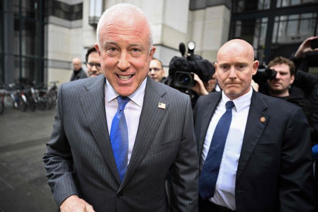 US Ambassador to Belgium Bill White (L) walks after a meeting at the offices of the Foreign Affairs department of the Federal Government in Brussels on February 24, 2026. US ambassador White was been summoned for a meeting, after he sharply criticised Belgium's Health Minister Vandenbroucke and accused Belgium of antisemitism over the prosecution of three Jewish ritual circumcisers in Antwerp. (Photo by JASPER JACOBS / Belga / AFP) / Belgium OUT