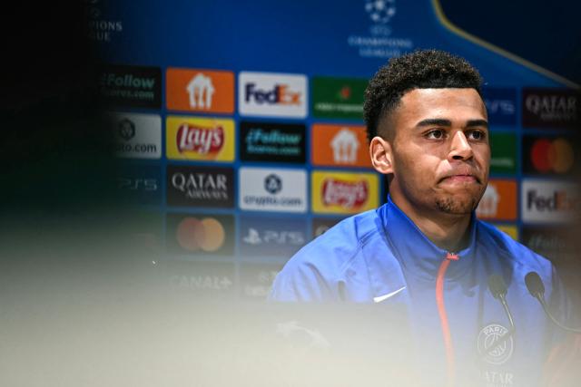 Paris Saint-Germain's French midfielder #14 Desire Doue reacts during a press conference at the Campus Paris Saint-Germain in Poissy, in the western outskirts of Paris on February 24, 2026, on the eve of the UEFA Champions League play-off second leg football match between Paris Saint-Germain and AS Monaco. (Photo by Anna KURTH / AFP)