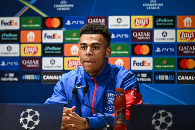 Paris Saint-Germain's French midfielder #14 Desire Doue reacts during a press conference at the Campus Paris Saint-Germain in Poissy, in the western outskirts of Paris on February 24, 2026, on the eve of the UEFA Champions League play-off second leg football match between Paris Saint-Germain and AS Monaco. (Photo by Anna KURTH / AFP)