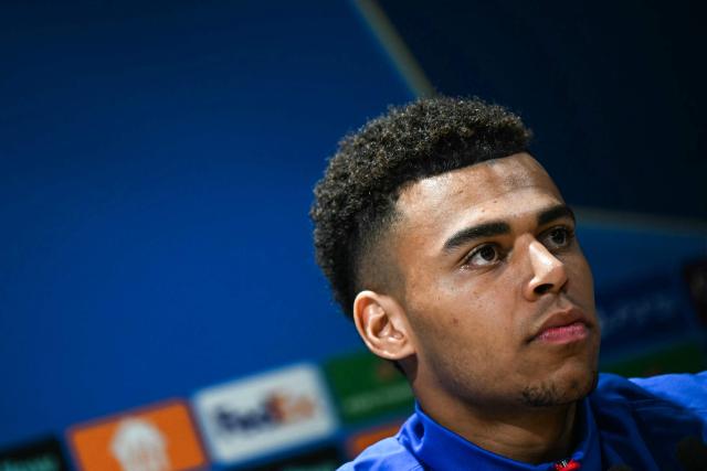 Paris Saint-Germain's French midfielder #14 Desire Doue looks on during a press conference at the Campus Paris Saint-Germain in Poissy, in the western outskirts of Paris on February 24, 2026, on the eve of the UEFA Champions League play-off second leg football match between Paris Saint-Germain and AS Monaco. (Photo by Anna KURTH / AFP)