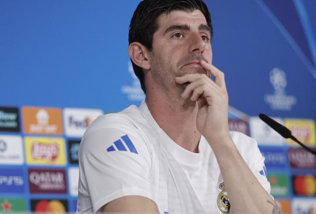 Real Madrid's Belgian goalkeeper #01 Thibaut Courtois gives a press conference on the eve of their UEFA Champions League knockout round play-off second leg football match against SL Benfica at Santiago Bernabeu Stadium at Real Madrid Sports City in Valdebebas, in the outskirts of Madrid on February 24, 2026. (Photo by Oscar DEL POZO / AFP)