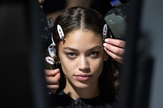 A model gets prepared before the Diesel collection show at the Milan's Fashion Week Womenswear Fall/Winter 2026-2027 in Milan on February 24, 2026. (Photo by MIGUEL MEDINA / AFP)