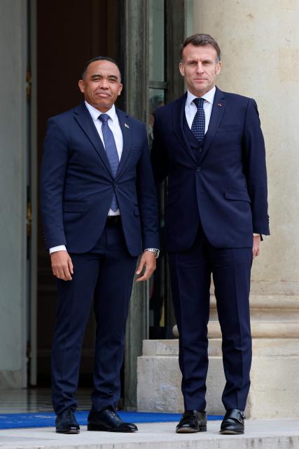 France's President Emmanuel Macron welcomes Madagascar's President Mickael Randrianirina before a meeting at The Elysee Presidential Palace in Paris on February 24, 2026. (Photo by Ludovic MARIN / AFP)