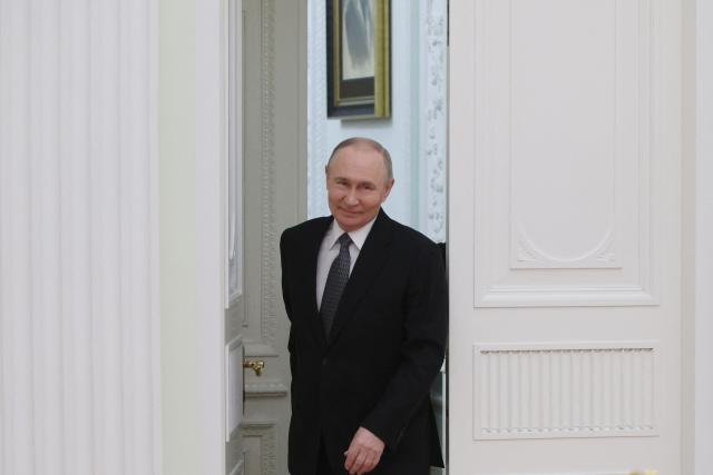 Russia's President Vladimir Putin arrives for a meeting with Vietnamese foreign minister in Moscow on February 24, 2026. (Photo by Maxim SHIPENKOV / POOL / AFP)