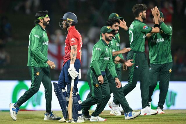 England's Phil Salt (2L) walks back after getting out as Pakistan's players celebrate during the 2026 ICC Men's T20 Cricket World Cup Super Eights match between England and Pakistan at the Pallekele International Cricket Stadium in Kandy on February 24, 2026. (Photo by Dibyangshu SARKAR / AFP)