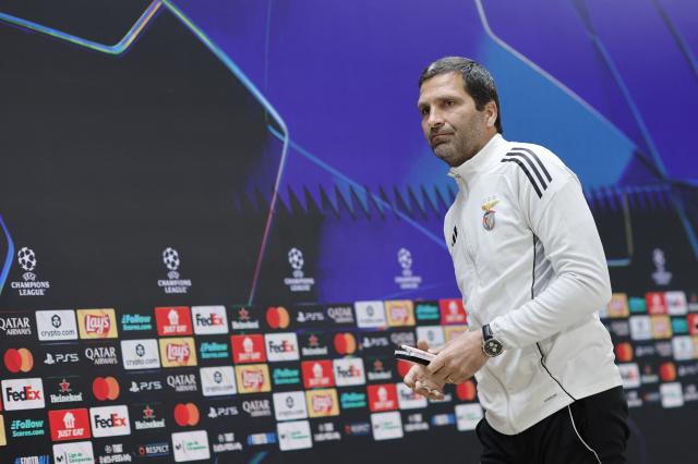 SL Benfica's assistant coach Joao Tralhao leaves after a press conference on the eve of their UEFA Champions League knockout round play-off second leg football match against Real Madrid CF at Santiago Bernabeu Stadium in Madrid on February 24, 2026. (Photo by Oscar DEL POZO / AFP)
